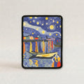 A cat scratch mat featuring a stylized night harbor scene inspired by Van Gogh's Starry Night, with a black stitched border on a light gray background.